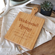 a wooden cutting board sitting on top of a table