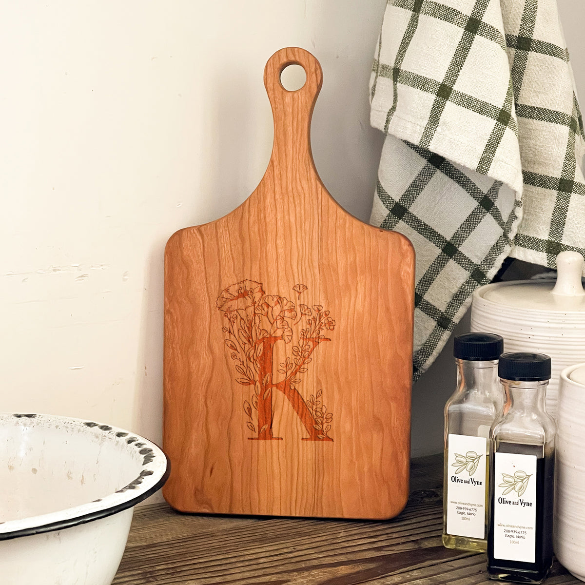 a wooden cutting board sitting on top of a table