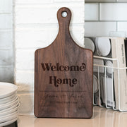 a wooden cutting board sitting on top of a counter