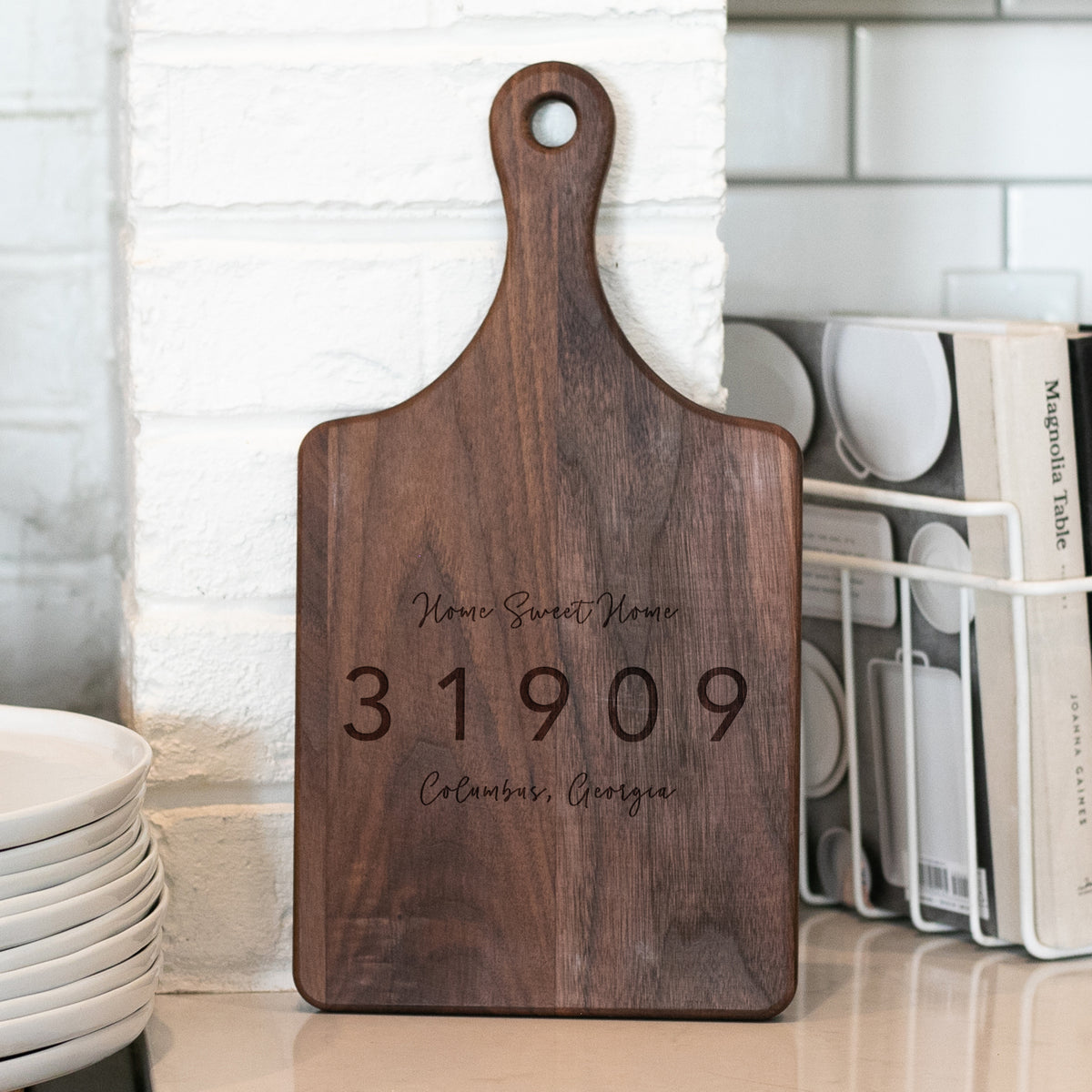 a wooden cutting board sitting on top of a counter