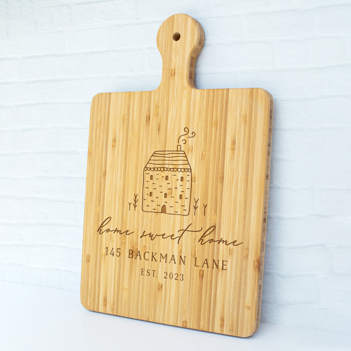 a cutting board with a picture of a building on it