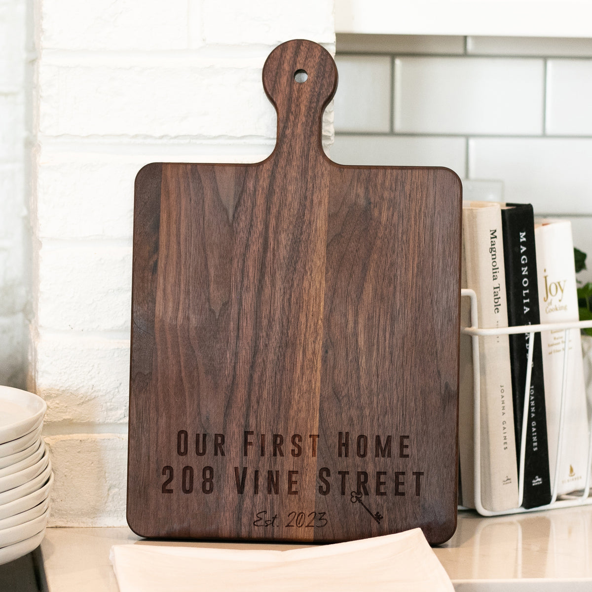 a wooden cutting board sitting on top of a counter