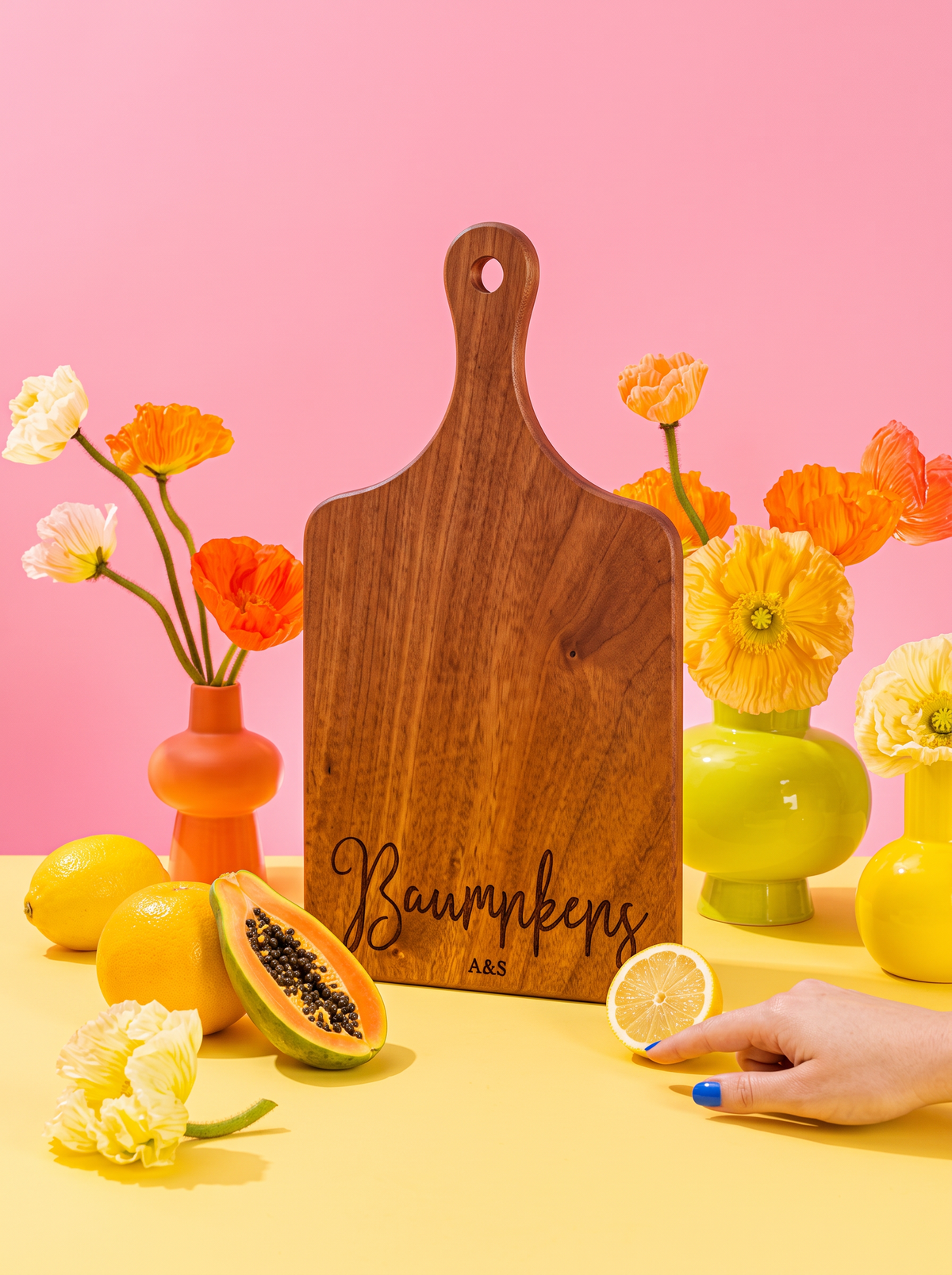 Modern Cursive Family Name Cutting Board in a colorful floral setting