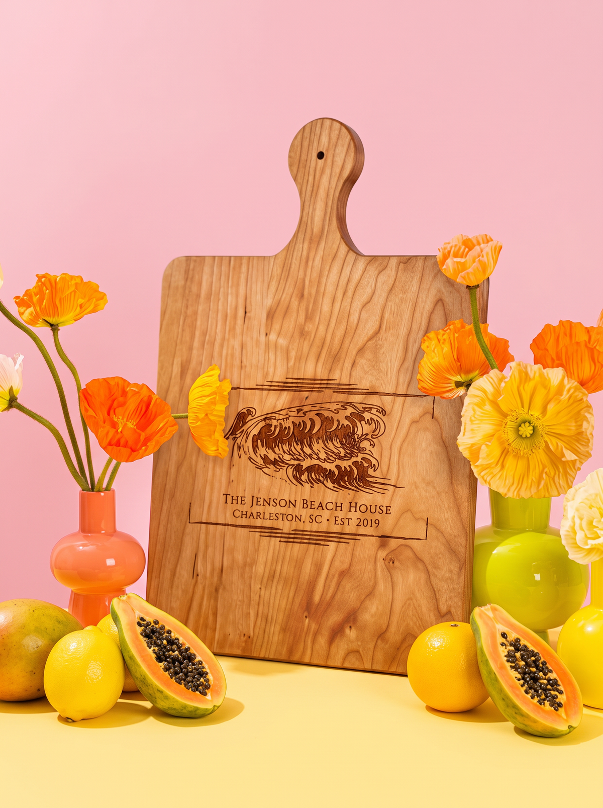 Coastal Wave Name Cutting Board in a colorful floral setting