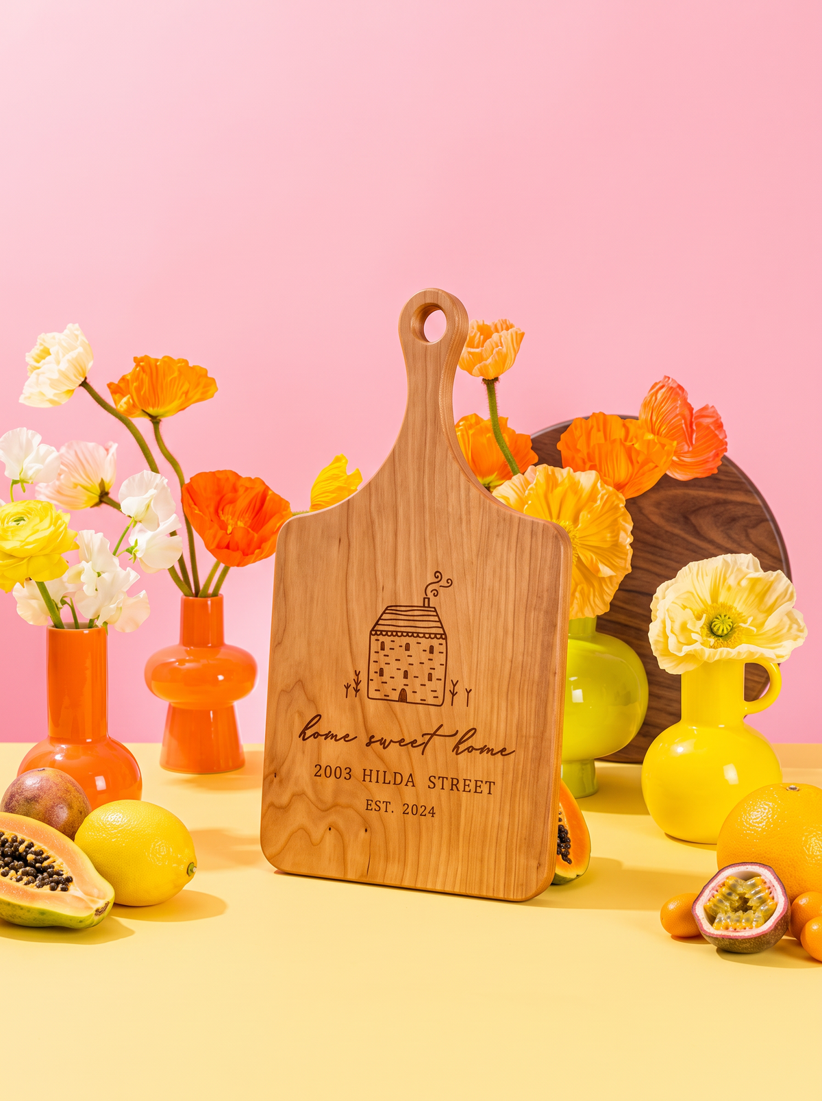 Home Sweet Home Cottage Cutting Board in a colorful floral setting