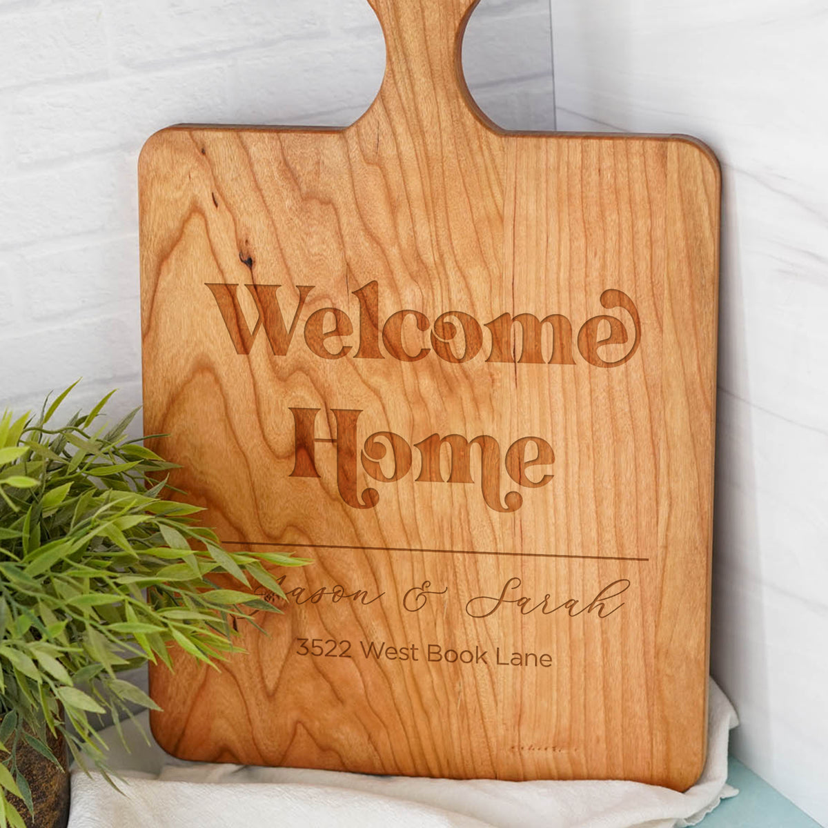 a wooden cutting board sitting on top of a table