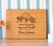 Edited mockup of paired doves, Song of Solomon 3:4, names and engagement date on a rectangular bamboo cutting board.