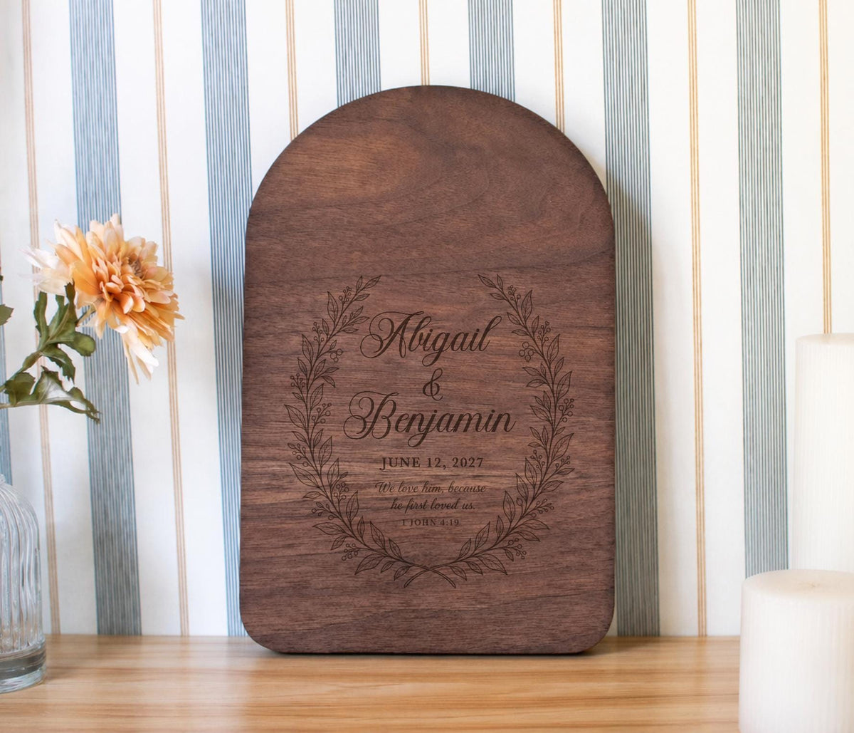 Edited mockup of first loved wreath on an arched board, personalized with Abigail and Benjamin and June 12, 2027.