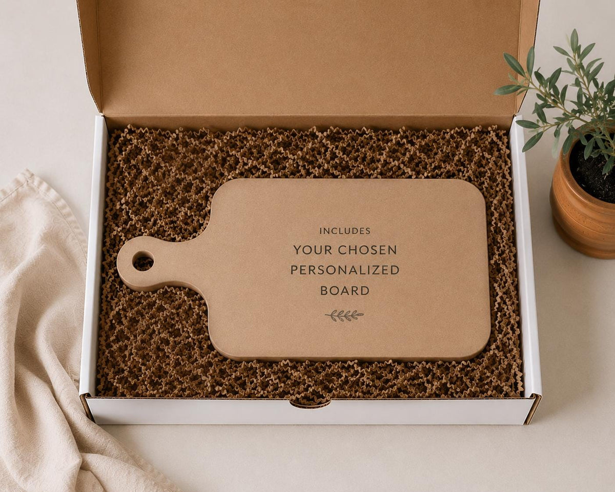 Gift box packaging example with filler and a placeholder representing the chosen personalized cutting board.