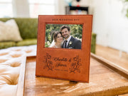 Wedding Roses frame mockup with a sample wedding photo, OUR WEDDING DAY, roses, Charlotte & James and June 14, 2026, on a tray in a living room.