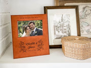 Wedding Roses frame mockup with a sample wedding photo, OUR WEDDING DAY, roses, Charlotte & James and June 14, 2026, on a shelf beside a woven basket.