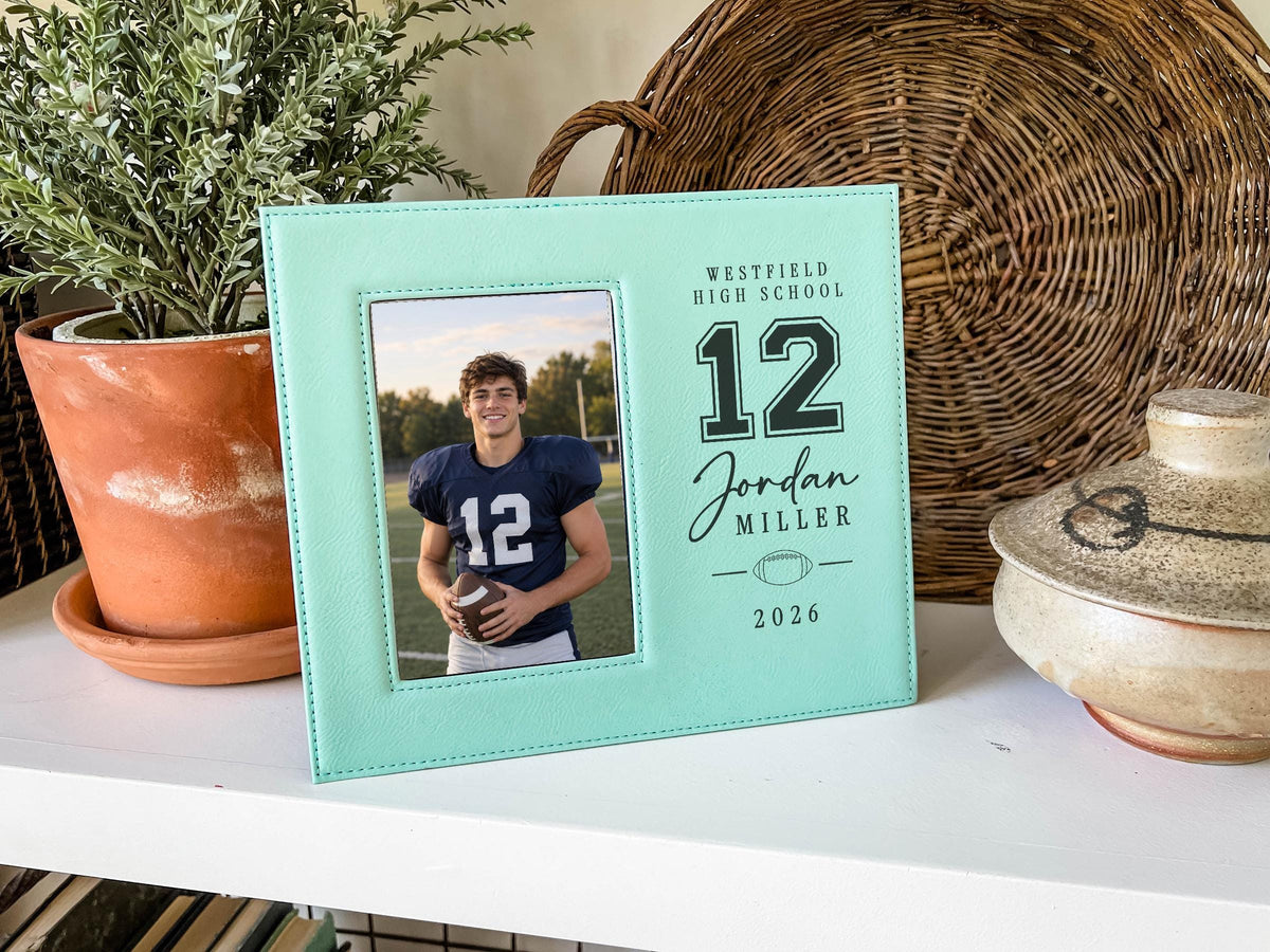 Teal Varsity Football frame mockup beside a potted plant and woven basket, with a sample football portrait and Jordan Miller number 12 personalization.