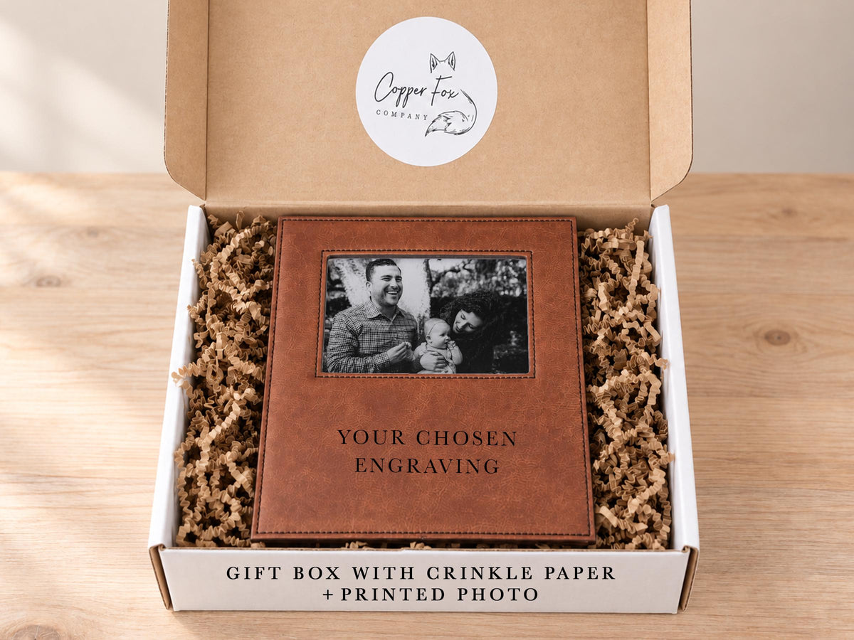 Shared Gift Box + Photo example: frame with an illustrative family photo in an open box with crinkle paper and placeholder engraving.