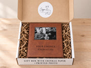 Shared Gift Box + Photo example: frame with an illustrative family photo in an open box with crinkle paper and placeholder engraving.