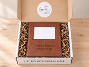 Shared Gift Box w/ Crinkle example: frame with an empty photo opening in an open box with crinkle paper and placeholder engraving.
