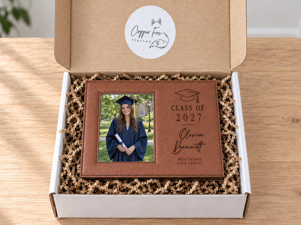 Grad Cap engraved frame reading Class of 2027, Olivia Bennett, Westbridge High School, with an illustrative graduation portrait. Edited mockup with sample personalization.