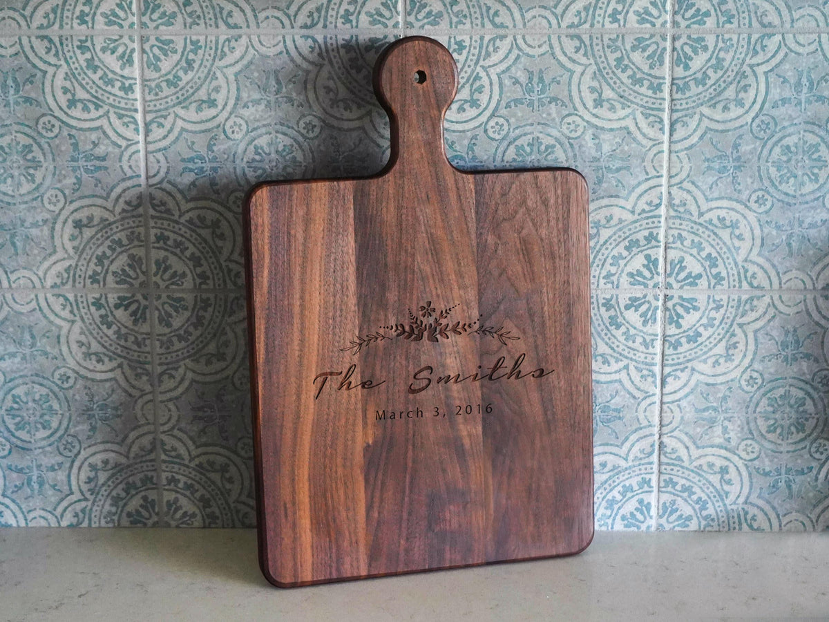 a wooden cutting board sitting on top of a counter