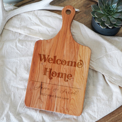 a wooden cutting board sitting on top of a table