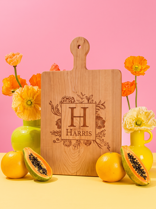 Floral Border Monogram Cutting Board in a colorful floral setting