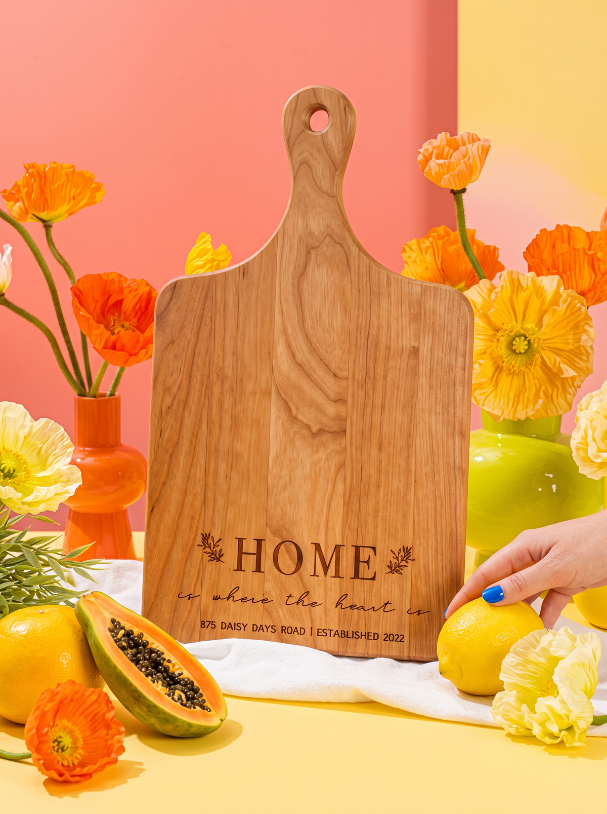 Home Is Where the Heart Is Cutting Board in a colorful floral setting