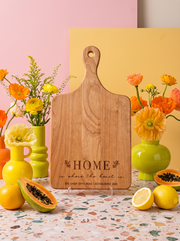 Home Is Where the Heart Is Cutting Board in a colorful floral setting