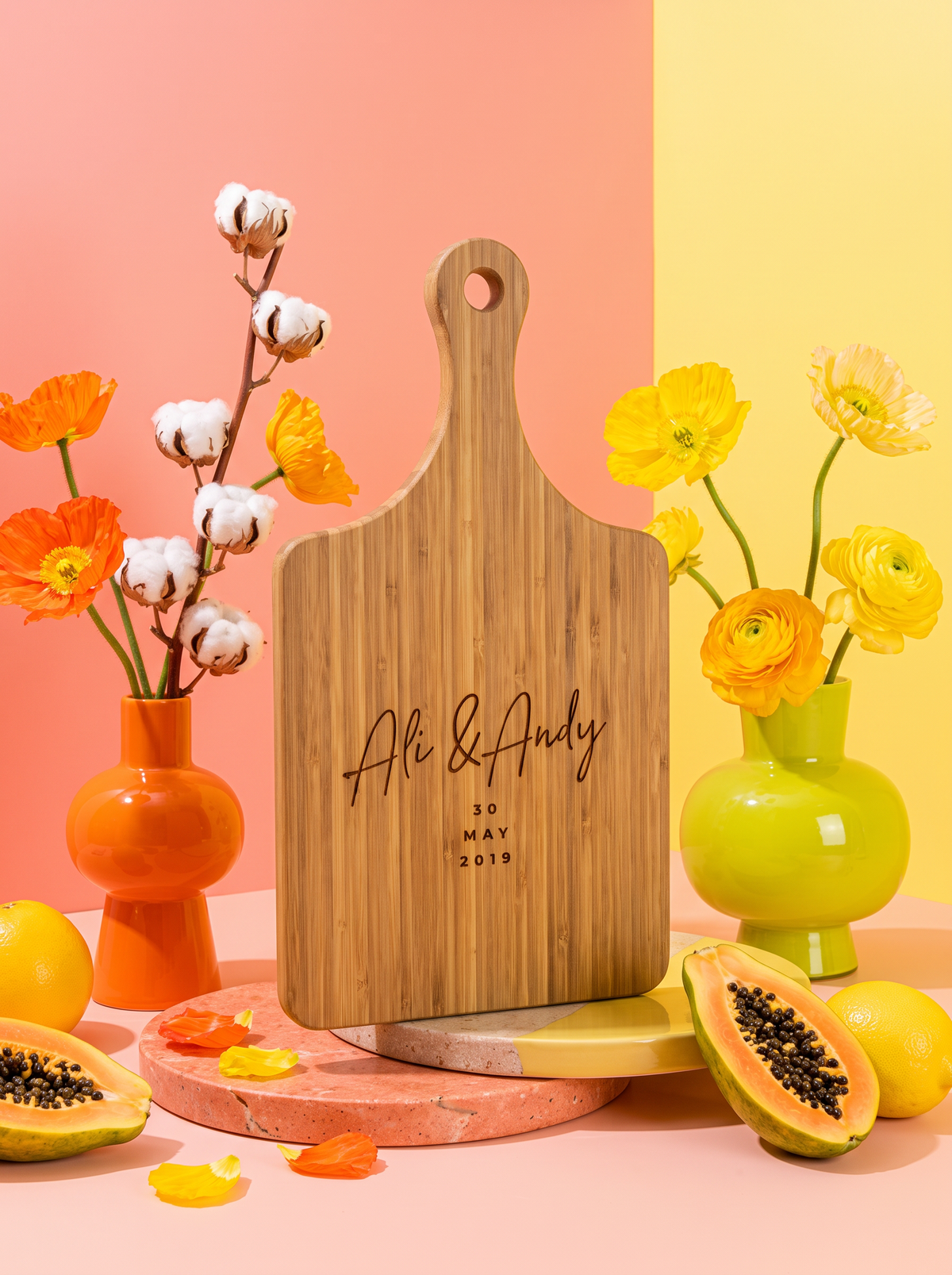 Modern Script Wedding Date cutting board in a colorful floral setting