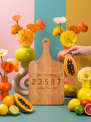 Home Sweet Home Zip Code Cutting Board in a colorful floral setting
