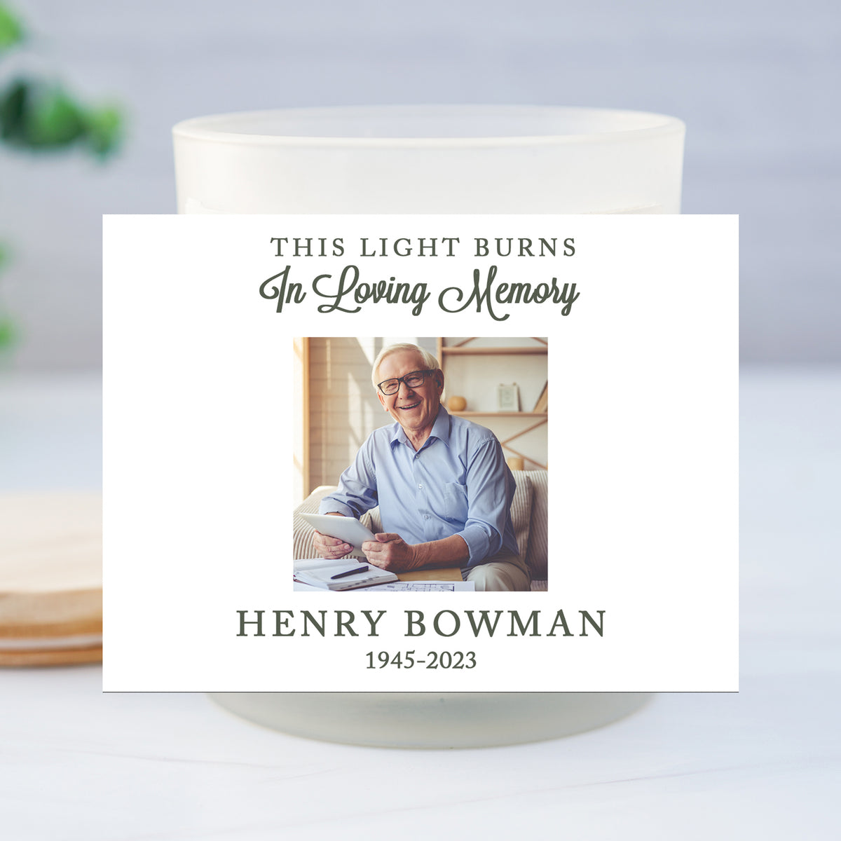 a candle with a picture of a man on it